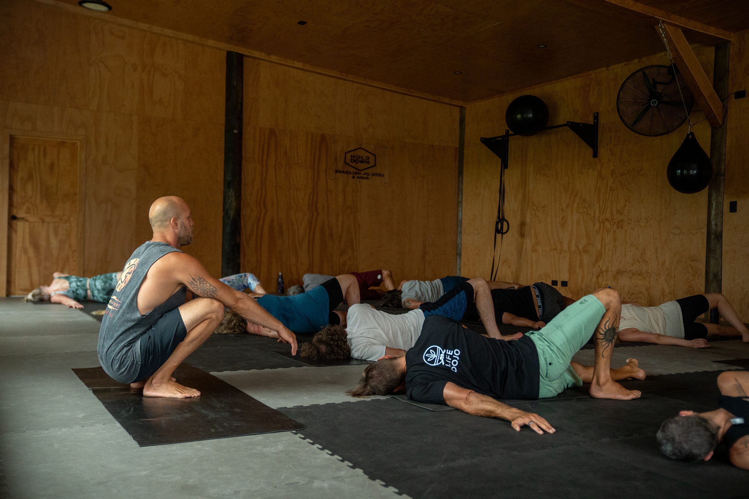 Hugo coaching a class through a floor movement sequence
